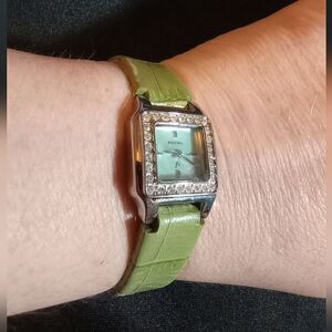 Ladies light green Fossil watch w leather band and small square face